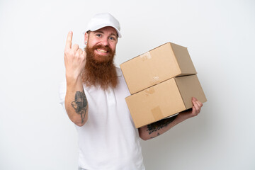 Delivery reddish man isolated on white background doing coming gesture