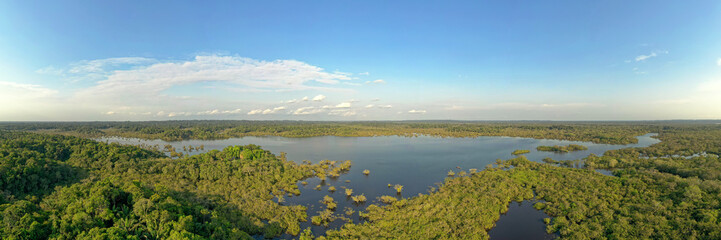 Amazonian national reserve Cuyabeno in Ecuador, wetland with lakes and ponds, river with piranas, dolphins, caymans, snakes and birds, aerial landscape view, green forest - obrazy, fototapety, plakaty