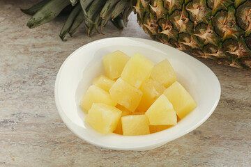 Marinated pineapple slices in the bowl