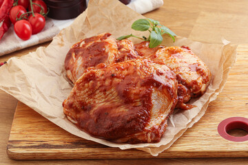Marinated chicken leg in tomato sauce