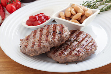 Grilled beef burger cutlet with sauce