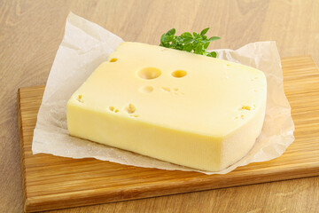 Maasdam cheese over the board