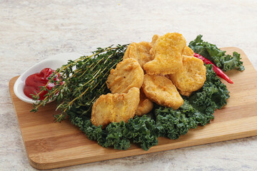 Crispy chicken nuggets with tomato ketchup