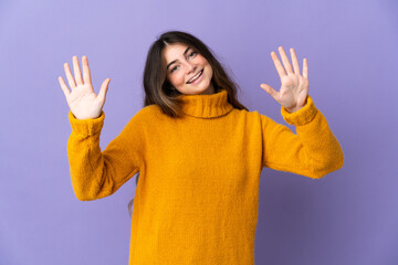 Young caucasian woman isolated on purple background counting ten with fingers