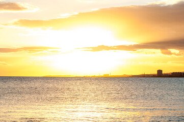 Beautiful orange Sunset on Montevideo's Rambla, summer sunset.