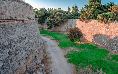 View of the medieval moat that surrounds the medieval city of Rhodes, Dodecanese, Greece.