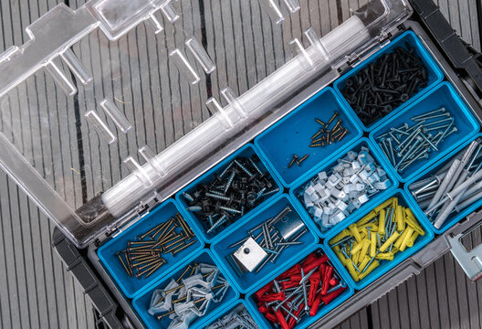 Variety of Wall Plugs and Screws Inside a Box