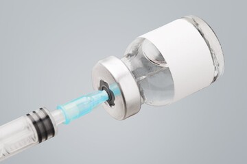 Doctor holding medical vaccine vial