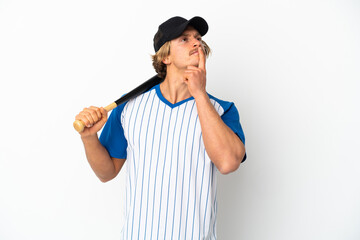 Young blonde man playing baseball isolated on white background having doubts while looking up
