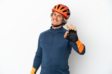 Young blonde cyclist man isolated on white background showing ok sign with fingers