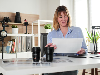 Female photographer working at office studio