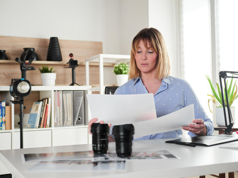 Female photographer working at office studio