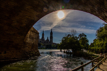  spring urban landscape with pillar cathedral in Zaragoza, spain and the Ebro river