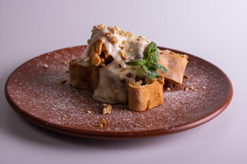 sweet apple muffins with powdered sugar and mint
