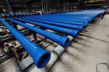 New cast iron pipes for pipeline construction in warehouse