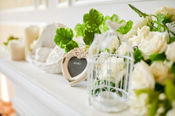 A nice decoration in the living room on the fireplace. Interior decorations