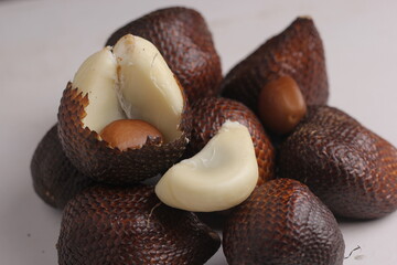 Salak or snake fruit isolated on a gray background