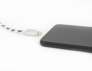 Charge by phone. Isolated on white background