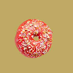 Red donut on yellow pastel background