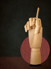 Composition with wooden hand holding a metal home key in round on brown background. Modern design, contemporary art collage. Trendy urban magazine style. Negative space to insert your text. 