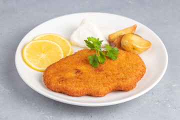 Homemade breaded chicken schnitzel . isolated on white background
