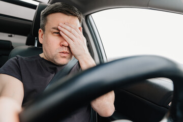 frightened man with closed eyes drives car on highway.dangerous accident on road