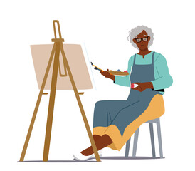 Senior Woman Artist Hold Paintbrush in Hand in Front of Canvas on Easel Drawing Picture. Aged African Lady Hobby
