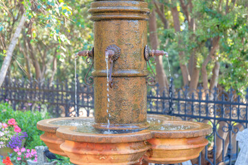 Antique bronze water fountain at San Francisco in California