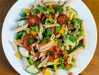 penne pasta salad with tomatoes and vegetables