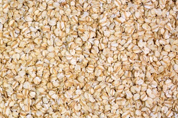 Heap of dry rolled oats isolated