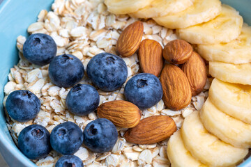 Oatmeal. With banana, blueberry and almond for healthy breakfast or lunch. Healthy diet nutrition.