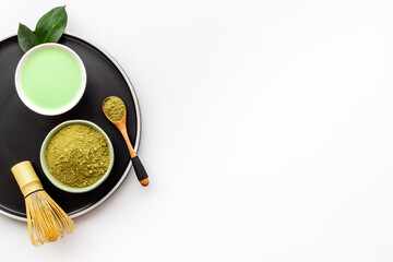 Tea ceremony with matcha powder and hot drink, top view