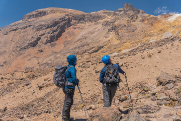 two man hiking on beautiful mountain trail