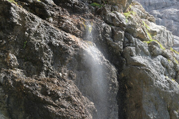 Close up of waterfall. Waterfall stream in Italian Alps.