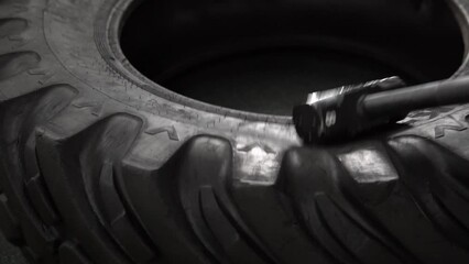 Black crossfit tire wheel sledgehammer workout athlete heavy fitness, concept healthy lifestyle effort weight for training from strength power, muscle healthy. Health up build,