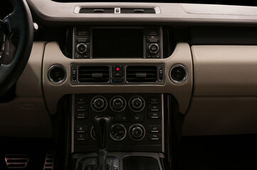 Obraz na płótnie Canvas Luxury car interior. Multimedia screen and control buttons. Modern car inside.