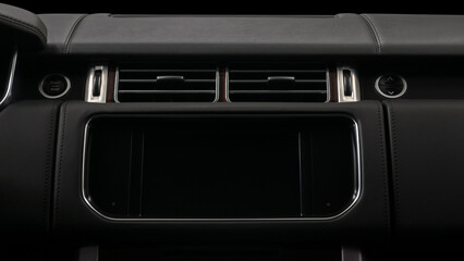 Multimedia screen in modern car. Interior detail. Horizontal photo.