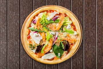 Traditional pizza with cheese and meat on wood desk. Pizza with four cheese combination. Cheese pizza.