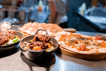 Close-up of tasty boiled egg with meat served in plate. Delicious food displayed on dining table. Yummy dinner at restaurant in luxurious holiday home.