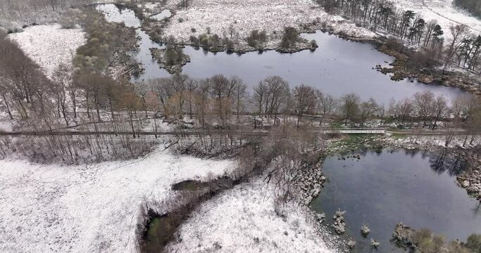 Aerial view of nature area Witte Veen with snow, Twente, Overijssel, Netherlands.