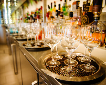 Wine glasses ready to be filled in a bar/restaurant setting