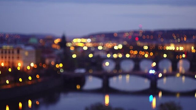 Police or ambulance driving across Prague bridge, flickering blurry lights effect, low aperture