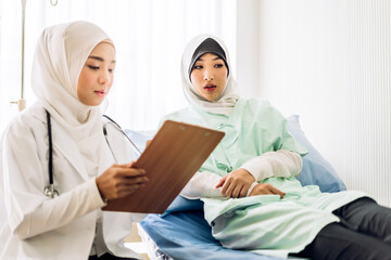 Muslim asian woman doctor service help support discussing and consulting talk to muslim woman patient at meeting health medical care express trust concept in hospital.healthcare and medicine