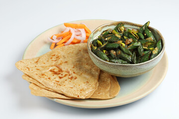 Bhindi masala or ladies finger fry served with indian roti chapati or Indian Flat bread