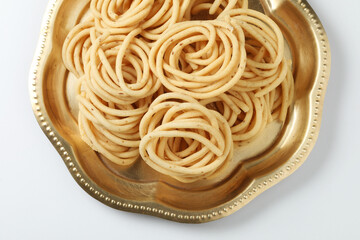 Traditional Indian Diwali snacks Chakali,murukku, Indian Traditional Tea Time Snack Chakli, a deep fried snack, It is known as Chakali, Murukku, Muruku, Murkoo, Chakri