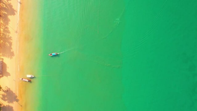 4K Aerial view of sandy beach and sea Beautiful turquoise sea waves, summer sea. (Aonang, Krabi, Thailand). Cinematic drone shot.
