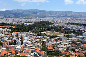 Fototapeta na wymiar Olympian Zeus Temple and Athens City from Acropolis in Greece. Athens is one of the world's oldest cities.