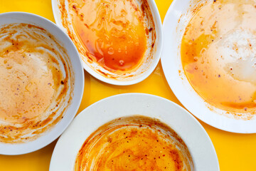 Dirty dishes on yellow background. Top view