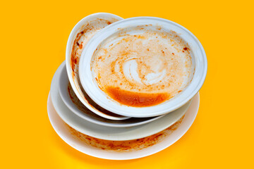 Dirty dish on yellow background.