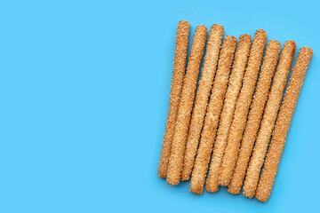 Bread sticks on blue background